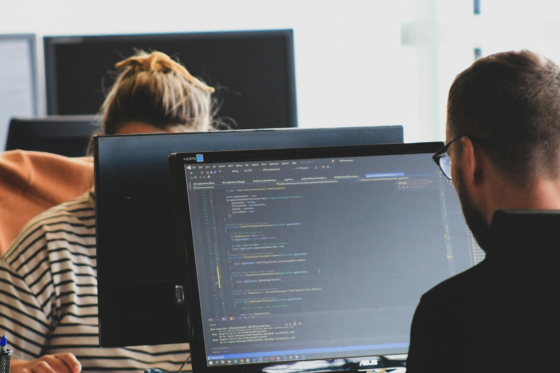 An image depicting a Web Developer working